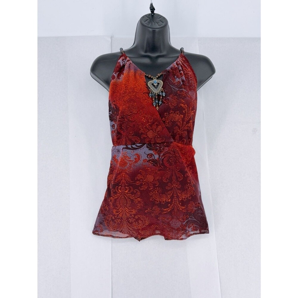 E eci Flowy Y2K-style vintage top in purple with a floral print.
size xl